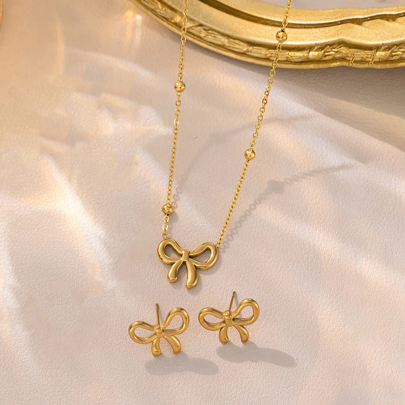 gold bow pendant necklace with matching bow earrings anti tarnish jewellery set